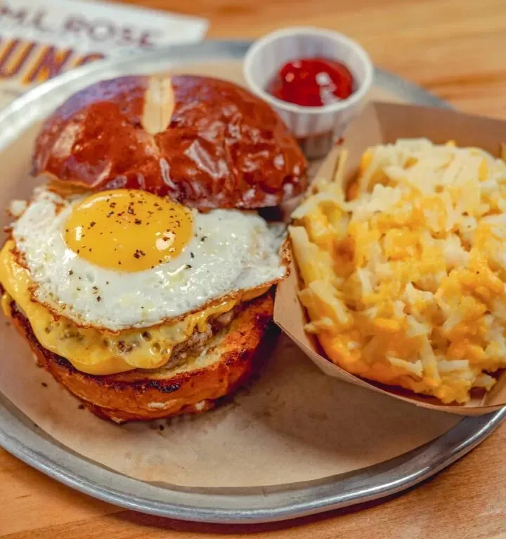 Breakfast plate with eggs, sausage, and macaroni and cheese